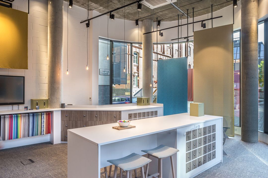 Island, reception and lighting rig in Camira's new Showroom in Clerkenwell