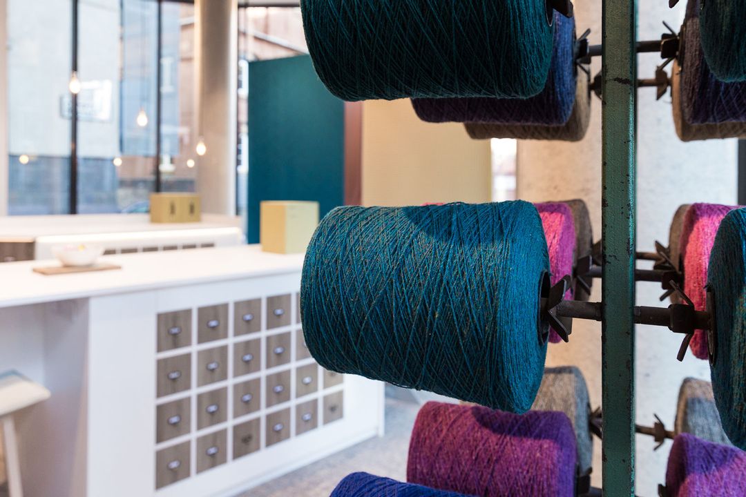 Close up of fabric spindles showing the island unit in the background