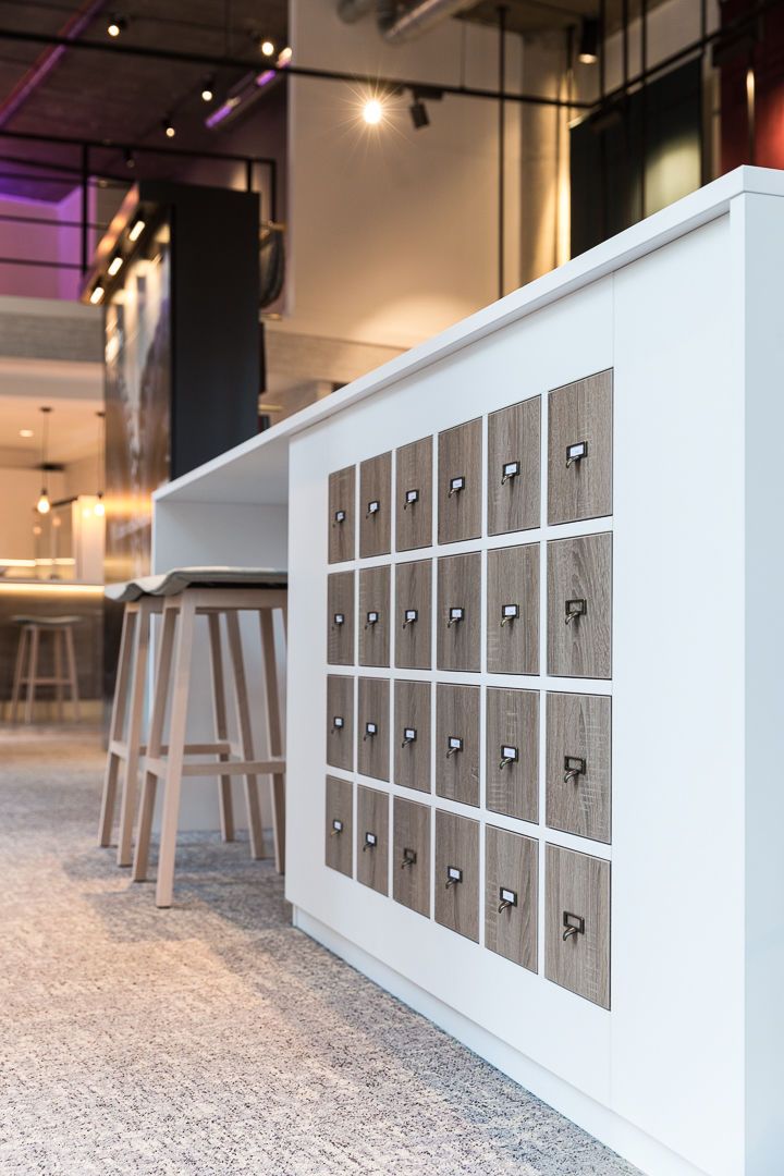Custom made island table unit with custom sized drawers to fit Camira's unique sized fabric swatches