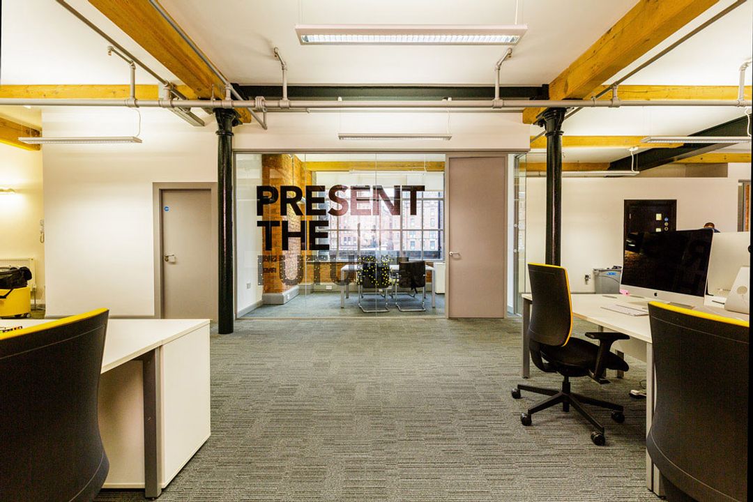 Buffalo 7 - Office space After fit out and furniture installation. Looking head on to the main glass partition with Buffalo 7 mural