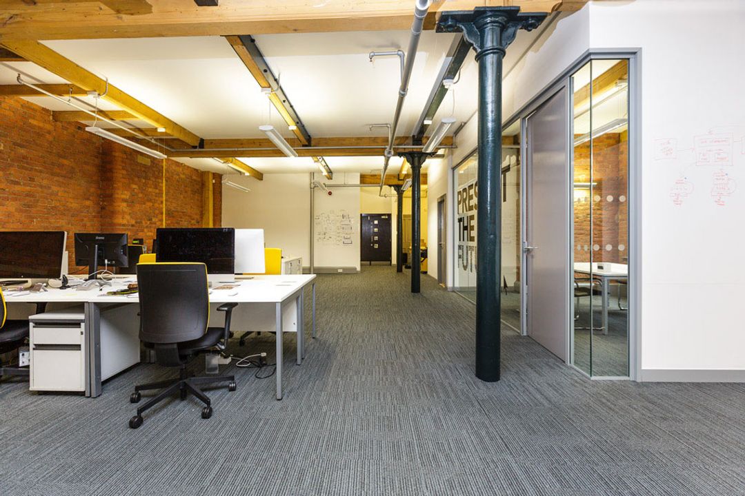 Buffalo 7 - Office space After fit out and furniture installation. Showing full length view of main office