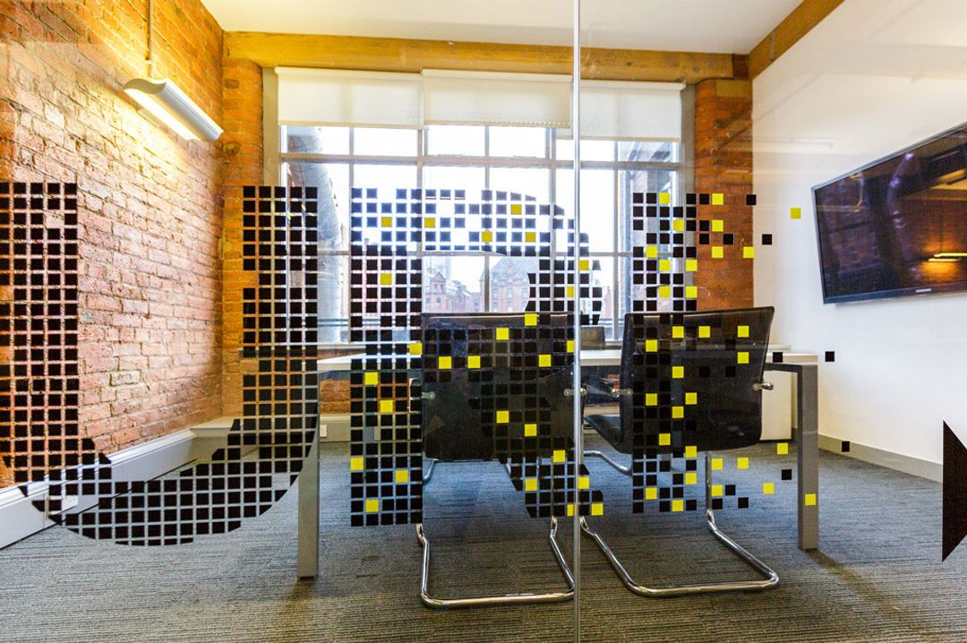 Buffalo 7 - Office space After fit out and furniture installation. Showing close up of glass partition mural
