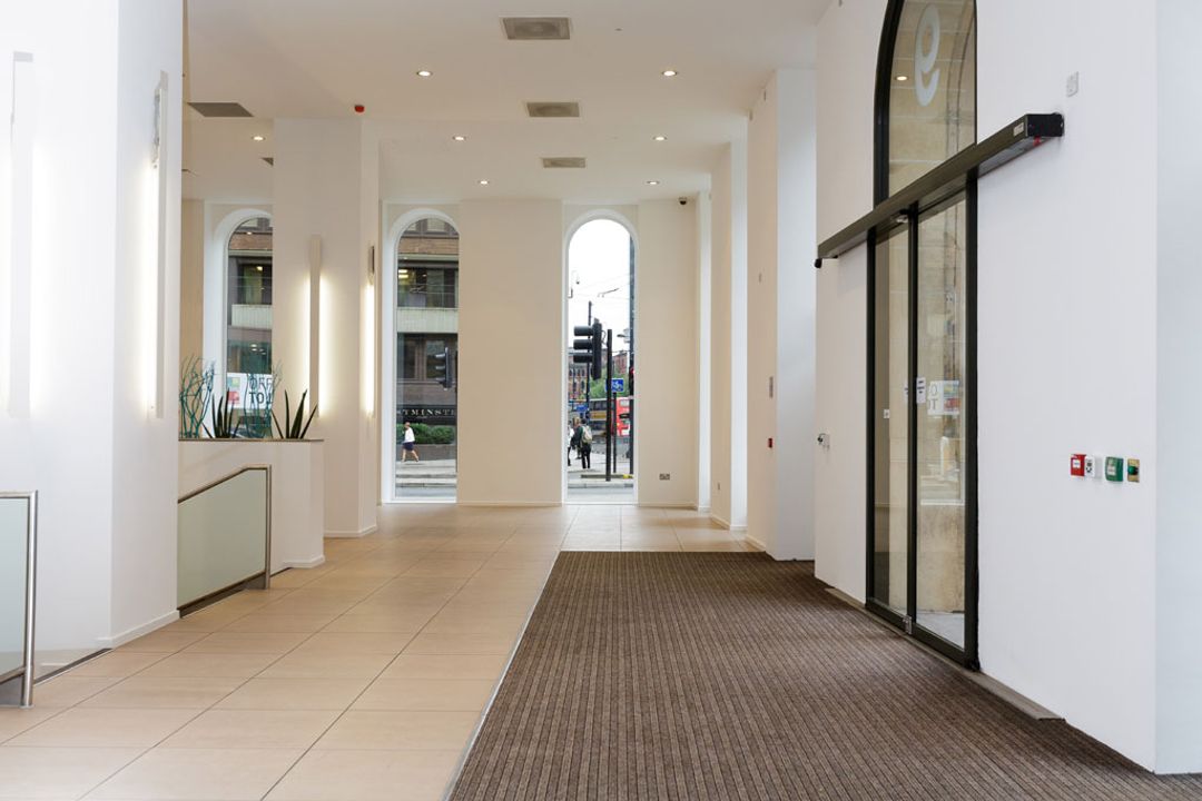 9 Portland Street, Manchester - before furniture installation. Showing empty space in reception area.