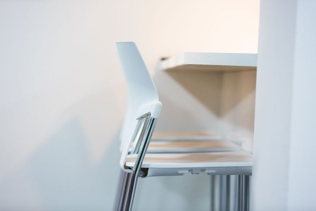 White Icon high stools next to breakout bar at Premier Group, Manchester