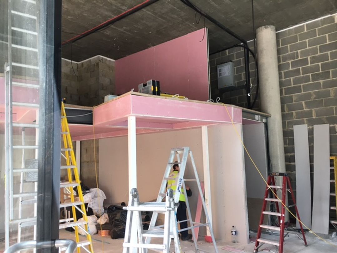 Fire rated partitions and boarding being applied to the mezzanine structure