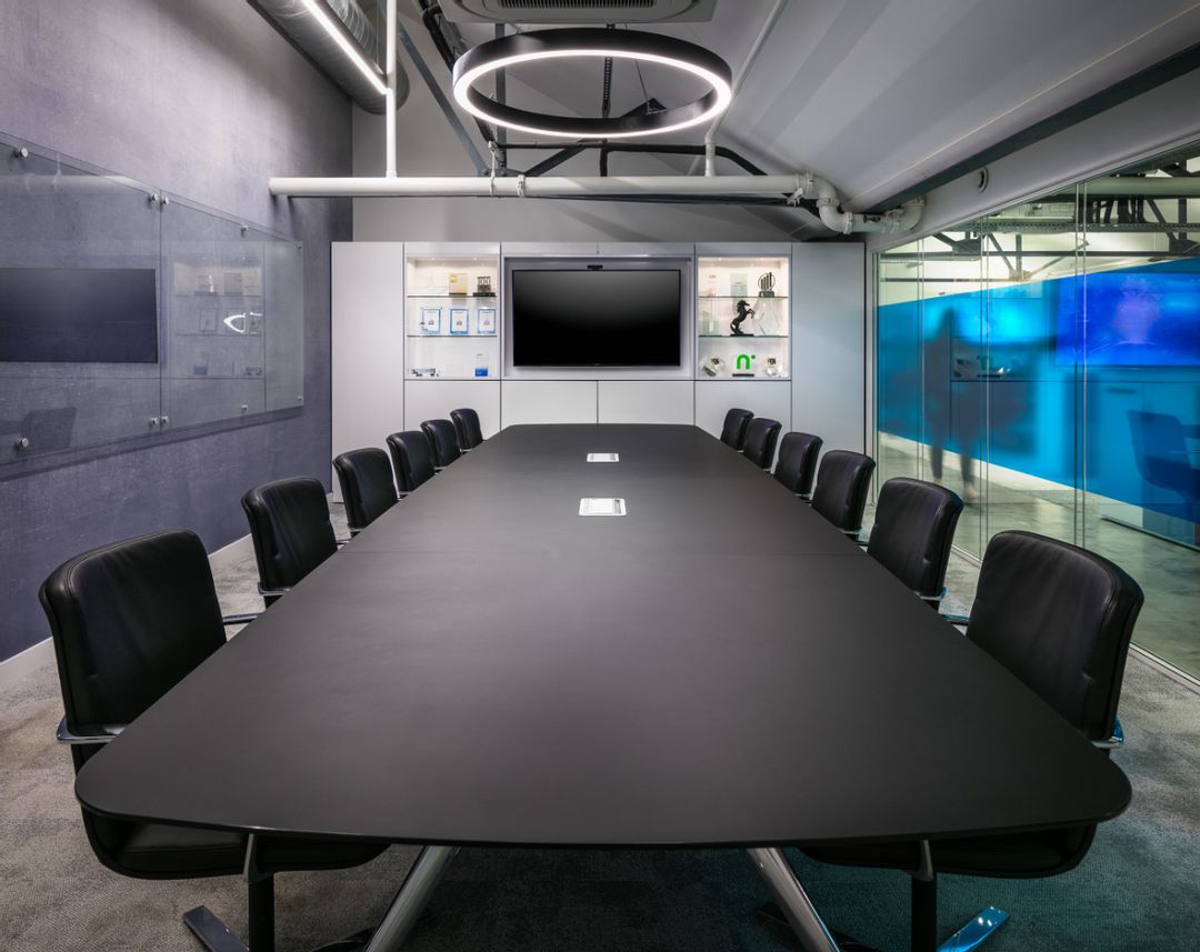 Car Finance 247 - 6th Floor Boardroom complete with Orangebox Lano boardroom table finished in black fenix with aluminium legs and Orangebox medium back Calder Chair in Yarwood black leather upholstery.