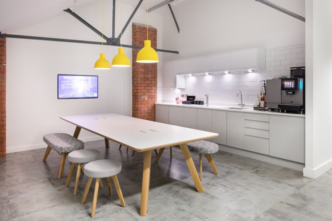 Car Finance 247 - 6th Floor Tea Point and Collaboration Area lit by Muuto's Unfold Pendant lamps and completed with Connection Seating's Centro Low Table, Stools and Bench