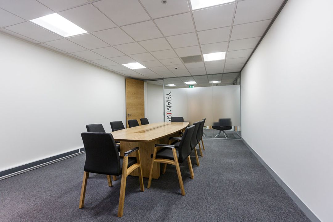 Primary Capital Boardroom with branded glass partition wall complete with Sven oak veneer table and Fulcrum F1 chairs