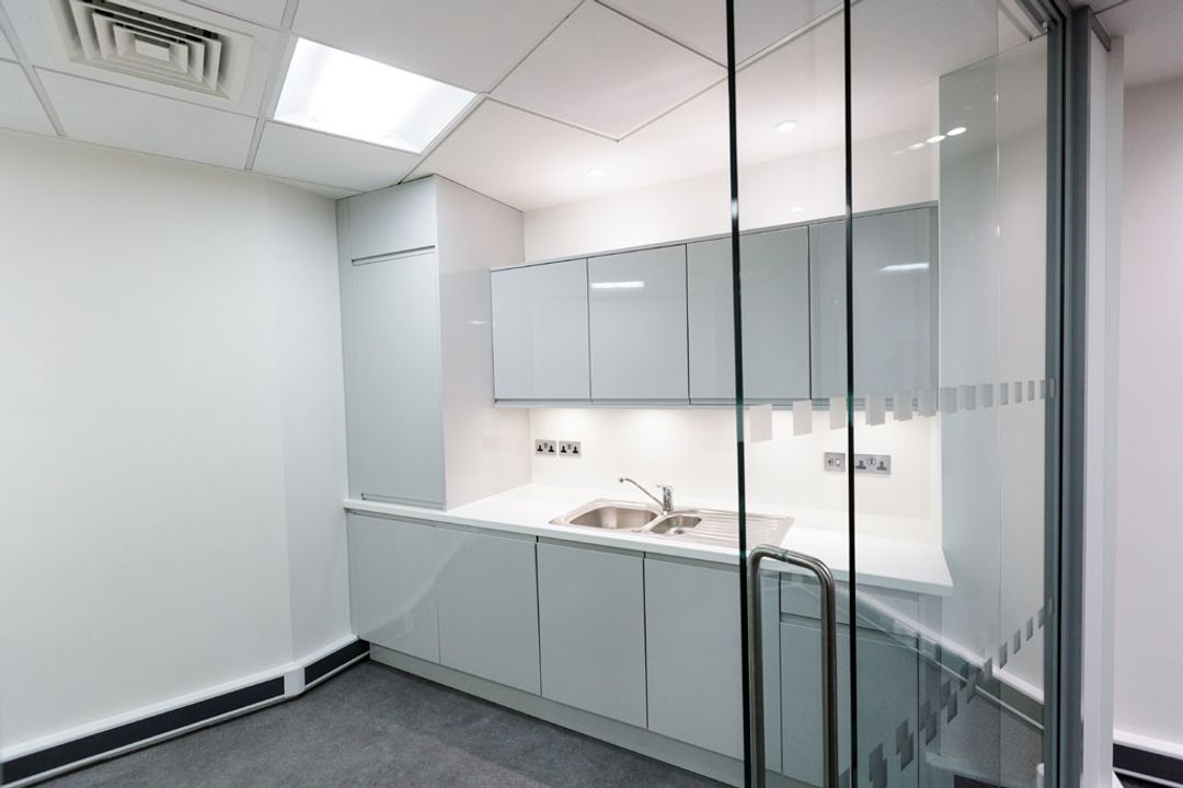 Sliding glass partition door leading on to separated kitchenette at the Primary Capital Manchester Offices