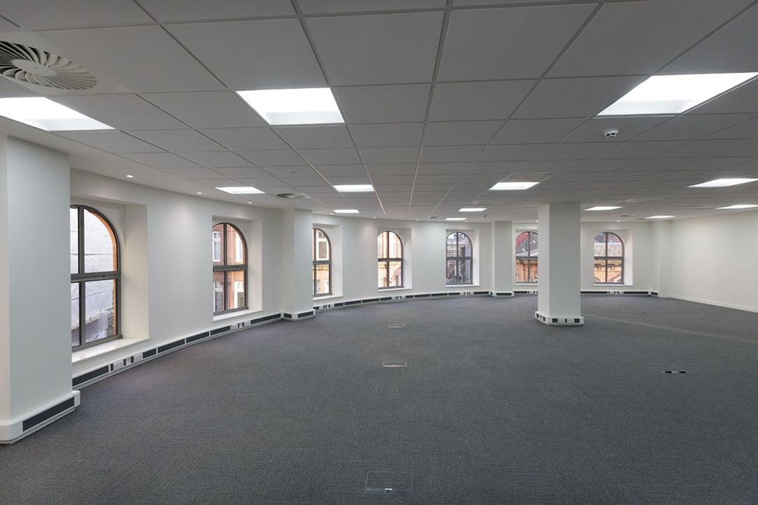 The east facing wall of an empty office space before the Spatial Office fit out for Premier Group, Manchester