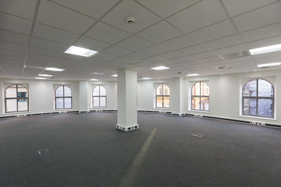 The north east corner of an empty office space before the Spatial Office fit out for Premier Group, Manchester